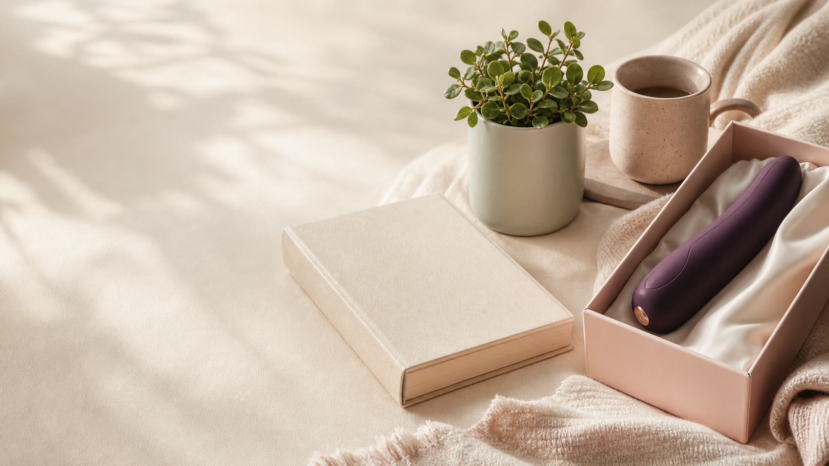 Soft morning light with ivory fabric, a closed book, a green plant, coffee, and discreet SENSIVO packaging.